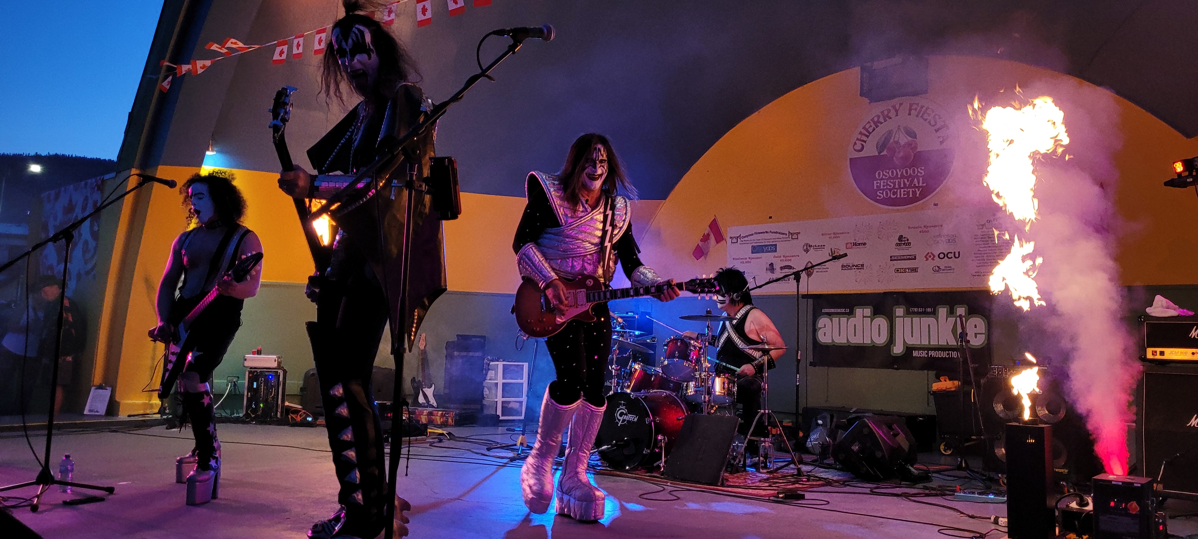 KISS tribute band performing live on stage with pyrotechnics and full audio setup